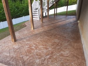 Photo of a patio with stamped concrete design.