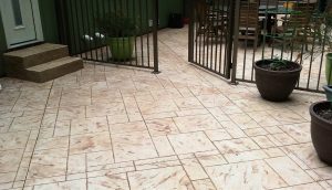 Photo of a patio with stamped concrete design.