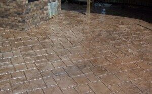 Photo of a patio with flagstone stamped concrete design.