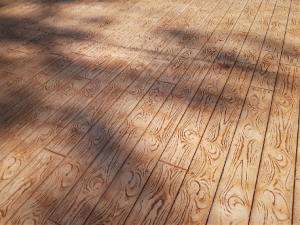 Photo of a patio with wood plank stamped concrete design.