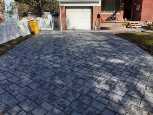 Photo of driveway with stamped concrete design.