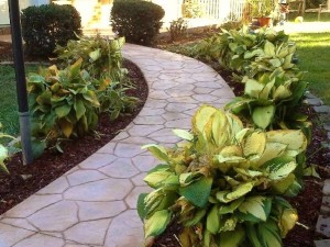 A photograph of a flagstone stamped concrete walkway