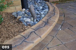 Photo of stamped concrete used for garden edges.