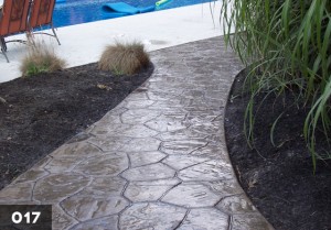 Random stone stamped concrete walkway.